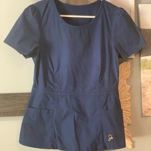 Jaanuu Peplum scrub top